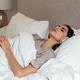 Woman in bed with headphones listening to meditation or relaxing sleep music Woman in bed with headphones listening to meditation or relaxing sleep music - PhotoDune Item for Sale