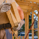 Construction Worker Carrying Wooden Planks at Building Site Construction Worker Carrying Wooden Planks at Building Site - PhotoDune Item for Sale