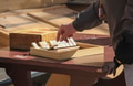 Low angle view of male playing on wooden Shut the Box game with dice and tiles, also called Canoga Low angle view of male playing on wooden Shut the Box game with dice and tiles, also called Canoga - PhotoDune Item for Sale