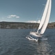 Race yacht at sun ocean bay aerial. Nobody nature landscape of Arran Island. Brodick town cityscape Race yacht at sun ocean bay aerial. Nobody nature landscape of Arran Island. Brodick town cityscape - PhotoDune Item for Sale