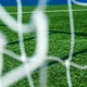 Soccer field green grass and net background. Soccer field green grass and net background. - PhotoDune Item for Sale
