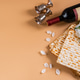Jewish holiday Passover. Bottle of wine, spring flowers and matzo bread Jewish holiday Passover. Bottle of wine, spring flowers and matzo bread - PhotoDune Item for Sale