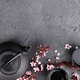 Japanese Tea Set with Cherry Blossoms on Dark Stone Background Japanese Tea Set with Cherry Blossoms on Dark Stone Background - PhotoDune Item for Sale