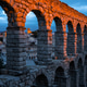Roman aqueduct of Segovia at sunset, Spain Roman aqueduct of Segovia at sunset, Spain - PhotoDune Item for Sale