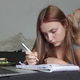 Young Woman Studying at Home Young Woman Studying at Home - PhotoDune Item for Sale