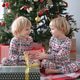 cute kids in Christmas pajamas with gift boxes at christmas morning cute kids in Christmas pajamas with gift boxes at christmas morning - PhotoDune Item for Sale