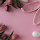 Easter Eggs with Bunny Ears and Tulips on Pink Background. Spring Holiday Flat Lay Easter Eggs with Bunny Ears and Tulips on Pink Background. Spring Holiday Flat Lay - PhotoDune Item for Sale