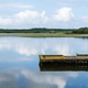 Lake of Soustons reflecting a cloudy sky and wooden docks Lake of Soustons reflecting a cloudy sky and wooden docks - PhotoDune Item for Sale