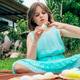 Cute little girl is painting Easter egg with her finger sitting on blanket on the grass in backyard Cute little girl is painting Easter egg with her finger sitting on blanket on the grass in backyard - PhotoDune Item for Sale