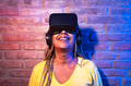 Senior African woman having fun playing with innovated virtual reality glasses Senior African woman having fun playing with innovated virtual reality glasses - PhotoDune Item for Sale