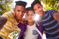 Multiethnic Group Of Teenagers Embracing Smiling At Camera Multiethnic Group Of Teenagers Embracing Smiling At Camera - PhotoDune Item for Sale