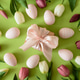 Easter Gift Box with Eggs and Spring Tulips on Green Background Easter Gift Box with Eggs and Spring Tulips on Green Background - PhotoDune Item for Sale