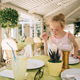 Little caucasian girl with curly blond hair drinks lemonade at a table in a cafe, vacation time Little caucasian girl with curly blond hair drinks lemonade at a table in a cafe, vacation time - PhotoDune Item for Sale
