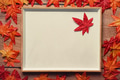 Empty picture frame with autumn maple leaves on wooden background. Empty picture frame with autumn maple leaves on wooden background. - PhotoDune Item for Sale
