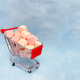 Miniature cart from a supermarket with marshmallows. Blue background Miniature cart from a supermarket with marshmallows. Blue background - PhotoDune Item for Sale