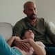 Cozy Family Moment On Couch With Dad Watching TV Cozy Family Moment On Couch With Dad Watching TV - PhotoDune Item for Sale