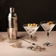 Serve Dry Martinis in Glasses With Olives and a Cocktail Shaker Nearby Serve Dry Martinis in Glasses With Olives and a Cocktail Shaker Nearby - PhotoDune Item for Sale