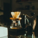 Alternative coffee brewing method, filter coffee, using pour over dripper v60 and paper filter. Alternative coffee brewing method, filter coffee, using pour over dripper v60 and paper filter. - PhotoDune Item for Sale