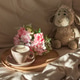 Cappuccino with Flowers and Plush Sheep on Cozy Bed under Morning Sunlight Cappuccino with Flowers and Plush Sheep on Cozy Bed under Morning Sunlight - PhotoDune Item for Sale