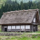 Typical traditional thick gassho zukuri style roof in Shirakawago in Japan during springtime. Typical traditional thick gassho zukuri style roof in Shirakawago in Japan during springtime. - PhotoDune Item for Sale