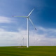 Aerial View of Wind Turbine for Clean Energy Against Blue Sky Aerial View of Wind Turbine for Clean Energy Against Blue Sky - PhotoDune Item for Sale