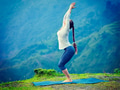 Woman doing yoga asana Utkatasana outdoors Woman doing yoga asana Utkatasana outdoors - PhotoDune Item for Sale