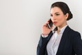 Portrait of serious pretty businesswoman talking on the phone in modern office Portrait of serious pretty businesswoman talking on the phone in modern office - PhotoDune Item for Sale