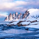 Tungeneset or Devils Jaw mountain on Senja island, Norway in winter. Tungeneset or Devils Jaw mountain on Senja island, Norway in winter. - PhotoDune Item for Sale