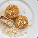 Oatmeal cookies with wooden scoop and oat flakes on a white plate Oatmeal cookies with wooden scoop and oat flakes on a white plate - PhotoDune Item for Sale