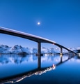 Bridge and reflection on the water surface. Natural landscape in the Lofoten islands, Norway. Bridge and reflection on the water surface. Natural landscape in the Lofoten islands, Norway. - PhotoDune Item for Sale