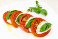 Caprese salad, slices of mozzarella and tomato, with basil and oregano. Caprese salad, slices of mozzarella and tomato, with basil and oregano. - PhotoDune Item for Sale
