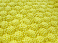 The texture of a knitted woolen fabric. Knit yellow sweater texture. The texture of a knitted woolen fabric. Knit yellow sweater texture. - PhotoDune Item for Sale