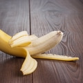 Fresh Peeled Banana On The Brown Background Fresh Peeled Banana On The Brown Background - PhotoDune Item for Sale