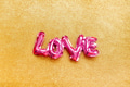Love concept. Inflatable pink balloon with letters Love concept. Inflatable pink balloon with letters - PhotoDune Item for Sale