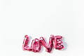 Love concept. Inflatable pink balloon with letters Love concept. Inflatable pink balloon with letters - PhotoDune Item for Sale