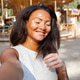 Happy woman with vitiligo skin problem taking selfie in city park Happy woman with vitiligo skin problem taking selfie in city park - PhotoDune Item for Sale