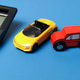 Car insurance cost and automotive financing concept with toy vehicles and office calculator on blue Car insurance cost and automotive financing concept with toy vehicles and office calculator on blue - PhotoDune Item for Sale
