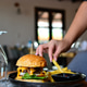Hamburger served in a restaurant. Elegant burger. Sandwich. Hamburger served in a restaurant. Elegant burger. Sandwich. - PhotoDune Item for Sale
