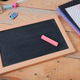 Small blank chalkboard on wooden table indoors Small blank chalkboard on wooden table indoors - PhotoDune Item for Sale