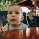 portrait of a child at a street cafe table portrait of a child at a street cafe table - PhotoDune Item for Sale