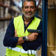 Male warehouse worker holding scanner smiling at camera Male warehouse worker holding scanner smiling at camera - PhotoDune Item for Sale