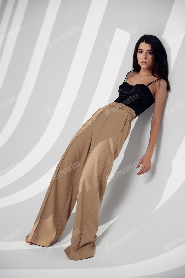 sexy woman in modern clothes and light room falling shadow Stock Photo by shotprime sexy woman in modern clothes and light room falling shadow Stock Photo by shotprime