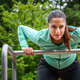 Athletic Woman Practicing Upper Body Workout On Bars At Public Fitness Park Athletic Woman Practicing Upper Body Workout On Bars At Public Fitness Park - PhotoDune Item for Sale
