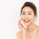 asian woman with fair perfect healthy glow skin hand touching cheek asian woman with fair perfect healthy glow skin hand touching cheek - PhotoDune Item for Sale