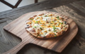 Pizza on a Wooden Board Pizza on a Wooden Board - PhotoDune Item for Sale