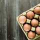 Eggs background. Closeup view of eggs in carton box on wooden table. Food and health concept. Eggs background. Closeup view of eggs in carton box on wooden table. Food and health concept. - PhotoDune Item for Sale