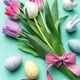 Easter tulips bouquet with eggs and bunnies on pastel background Easter tulips bouquet with eggs and bunnies on pastel background - PhotoDune Item for Sale