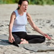 Adult woman practicing pranayama breathing exercise on Sandy Beach near Baltic Sea Adult woman practicing pranayama breathing exercise on Sandy Beach near Baltic Sea - PhotoDune Item for Sale