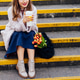Cropped young smiling woman with fresh tulips and coffee cup sitting on stairs at the city street Cropped young smiling woman with fresh tulips and coffee cup sitting on stairs at the city street - PhotoDune Item for Sale