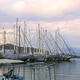 Fethiye, Turkey - December 8, 2022: Yachts Moored in Harbor at Sunset, Boats Reflected in a Water. Fethiye, Turkey - December 8, 2022: Yachts Moored in Harbor at Sunset, Boats Reflected in a Water. - PhotoDune Item for Sale